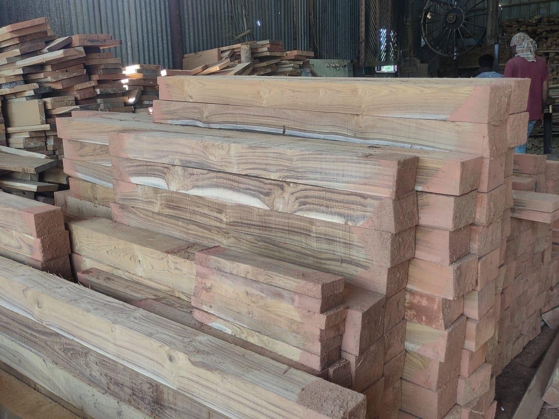 Stacked planks inside the saw mill workshop